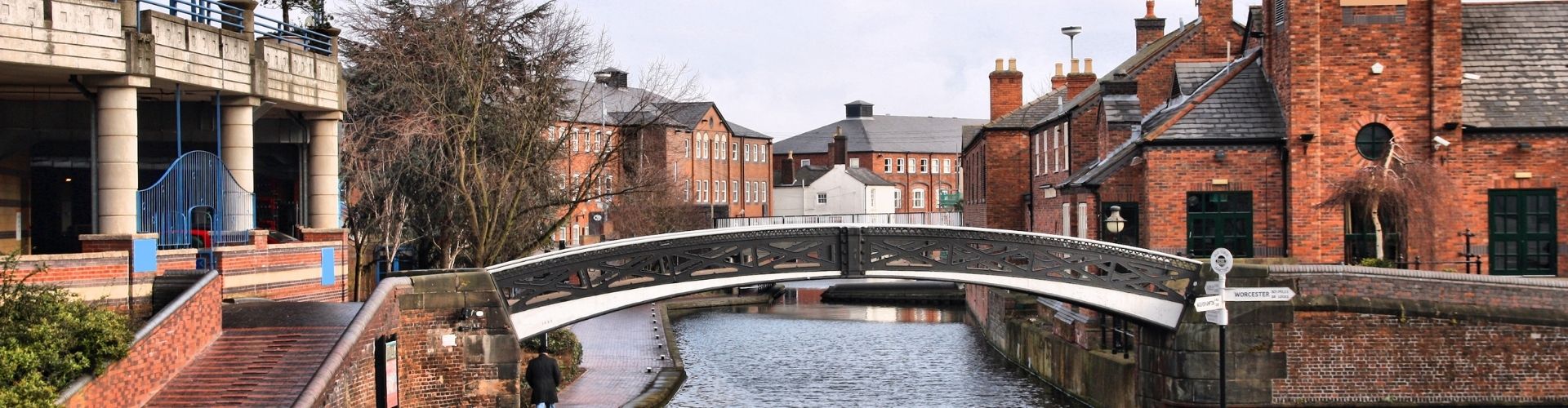 Bridge over river with brick buildings