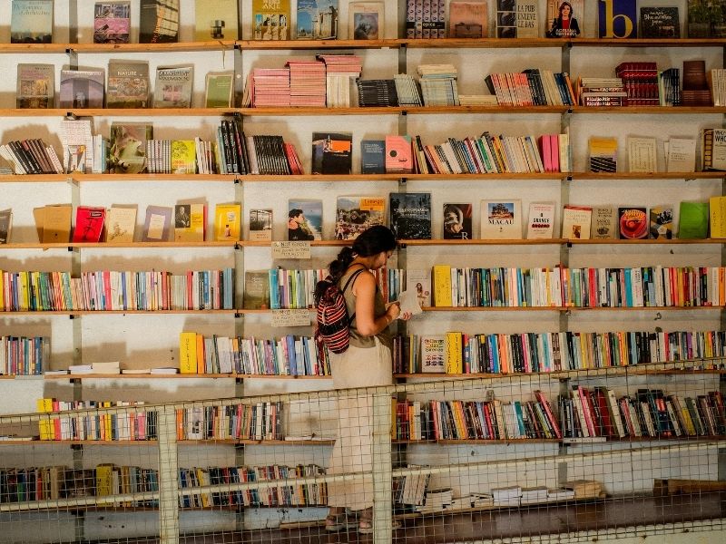 tourist in small bookshop