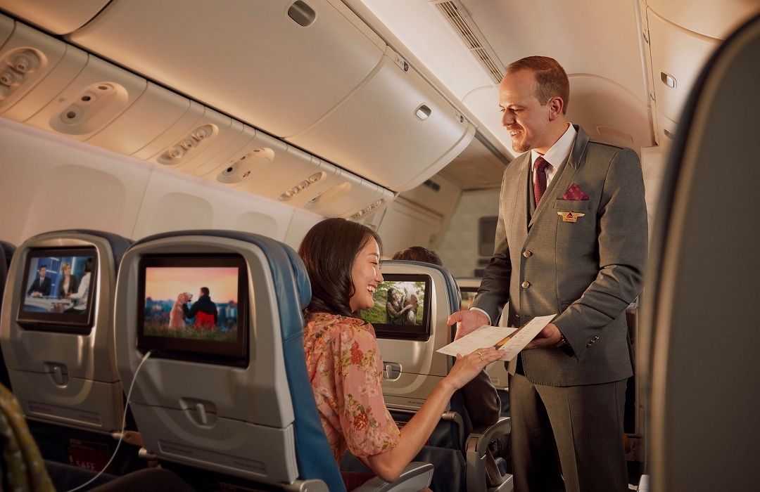 passenger viewing menu on delta flight