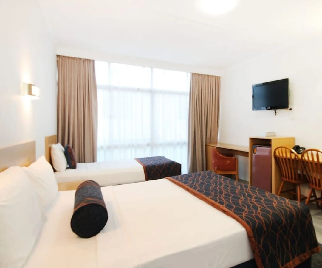 Two double beds in hotel room