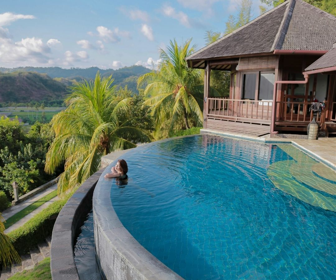 Infinity pool overlooking palm trees