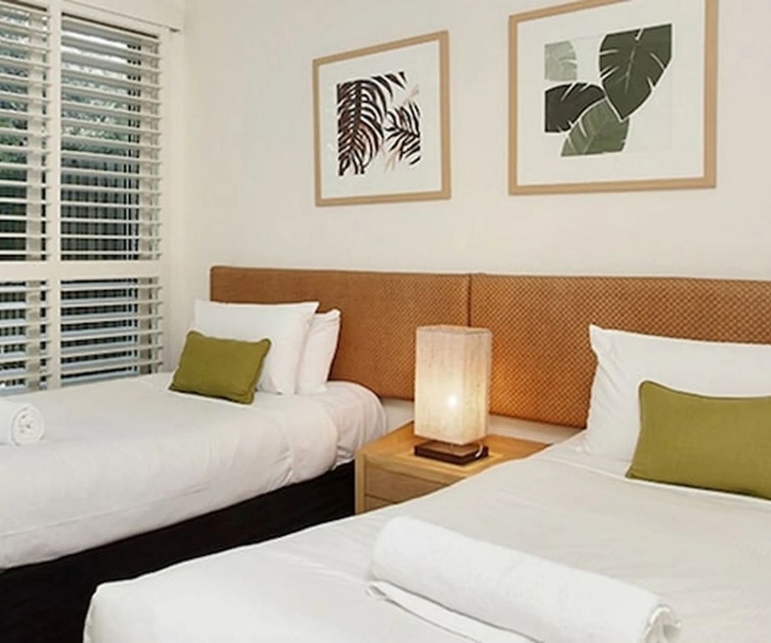 Basic hotel room with two single beds