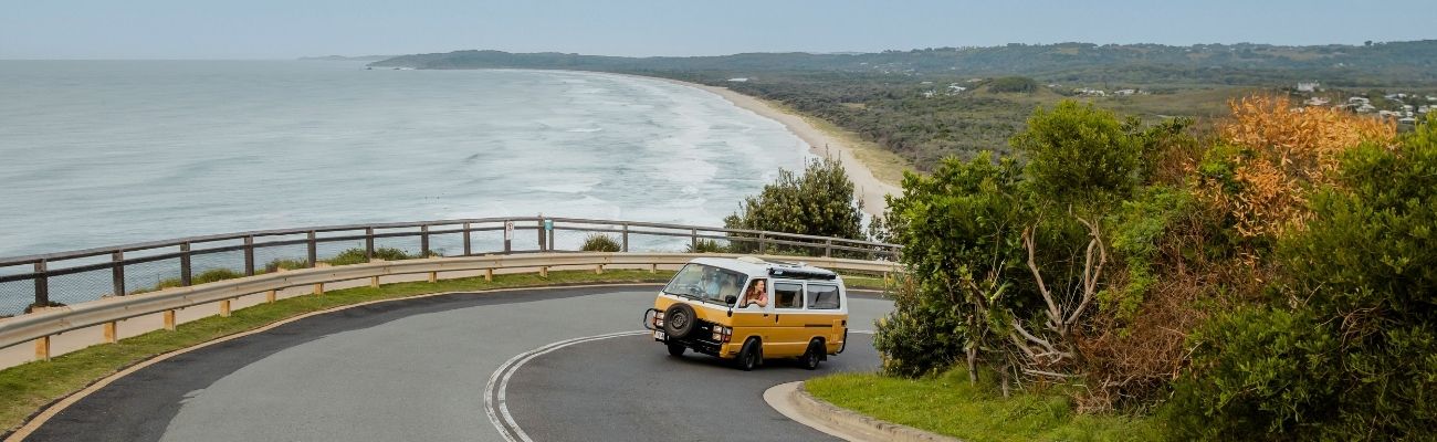 Camper driving on coastal road