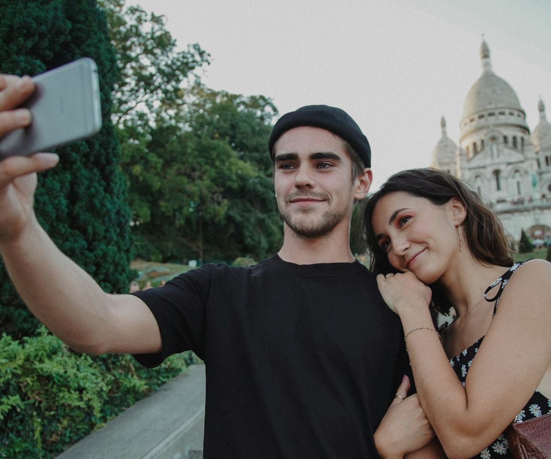 Couple taking selfie in Paris