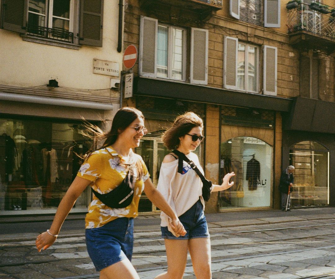 Friends walking in Italian city