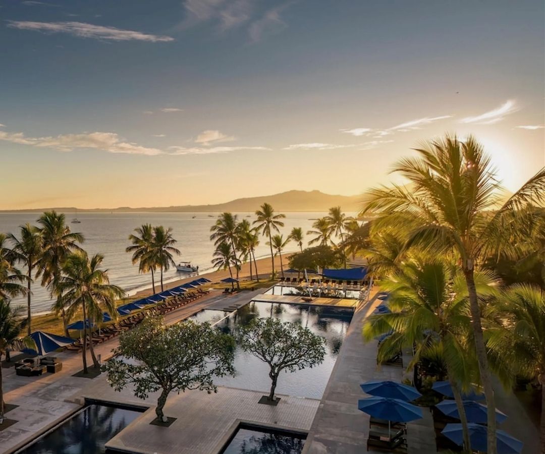 View over hotel by sea at sunset