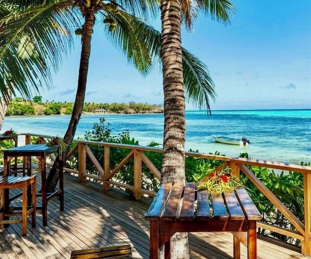 View over ocean with palm trees