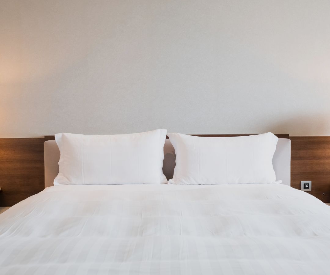 Neatly made hotel bed