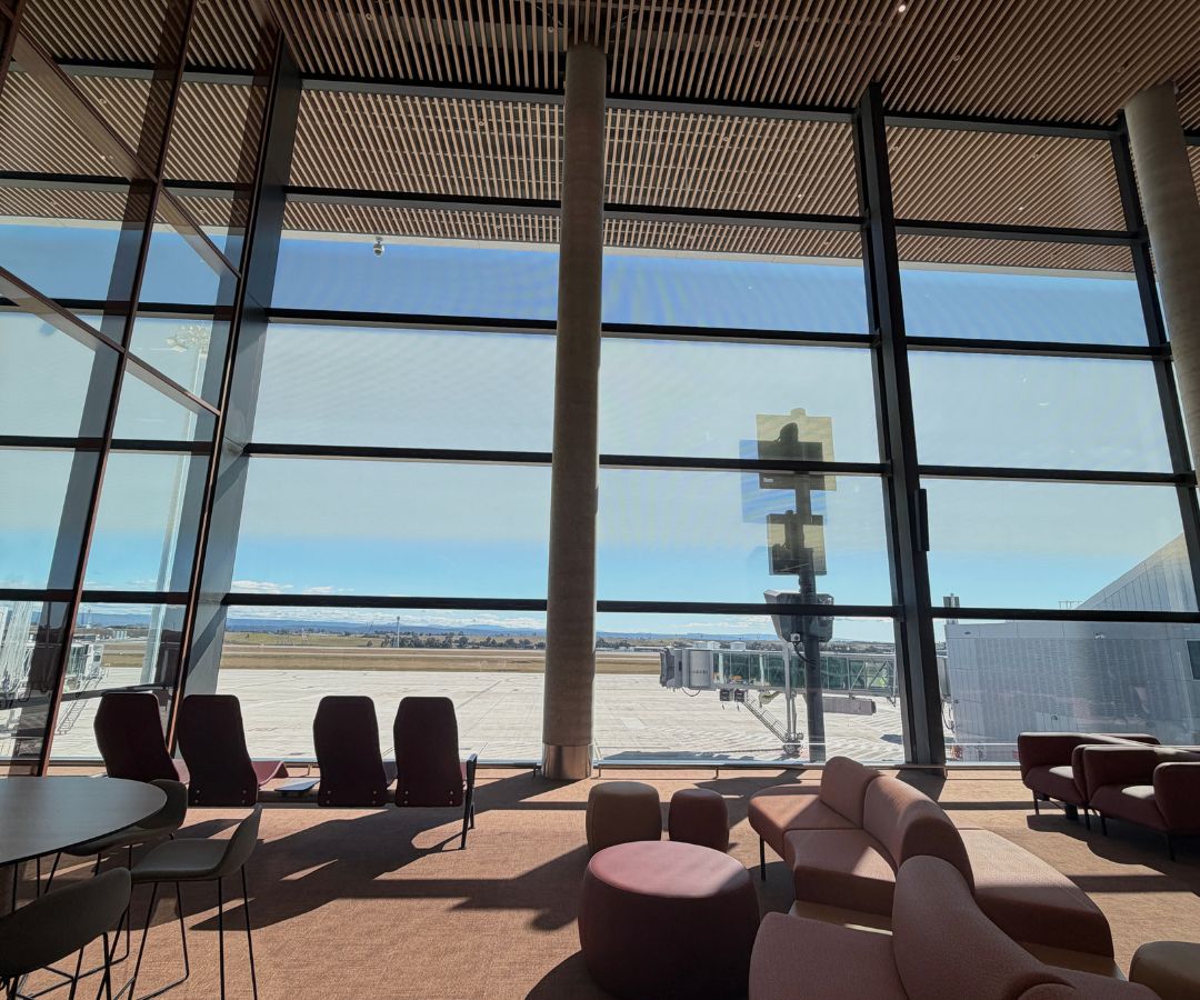 departure waiting area overlooking runway
