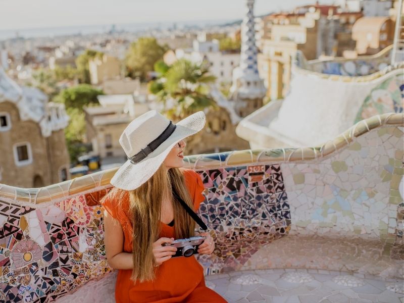 lady at Park Güell mosaic barcelona