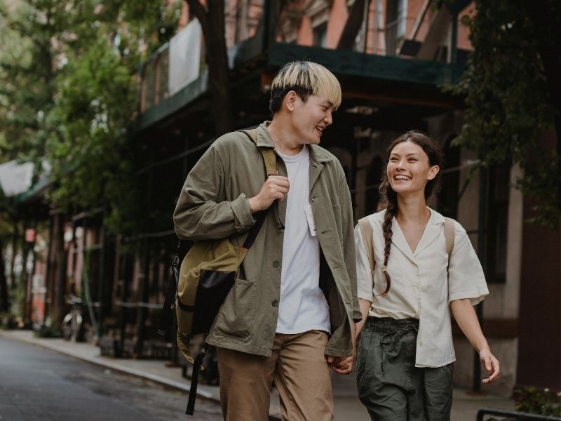 smiling couple exploring the streets