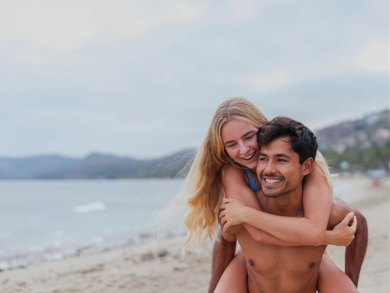 couple smiling on beach