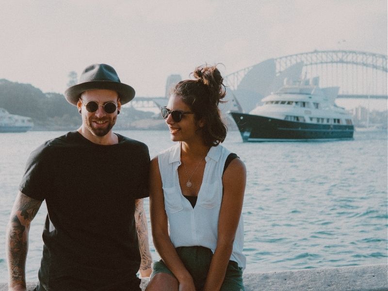 couple with sydney opera house and sydney hrabour brisge in background