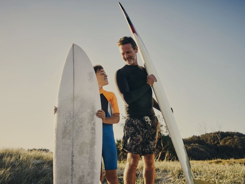 father and son surfing