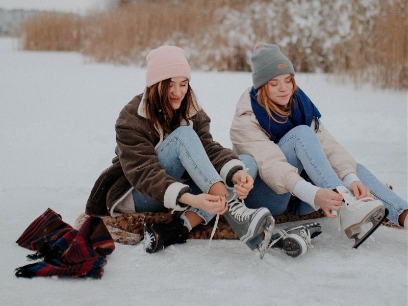 friends putting on iceskates