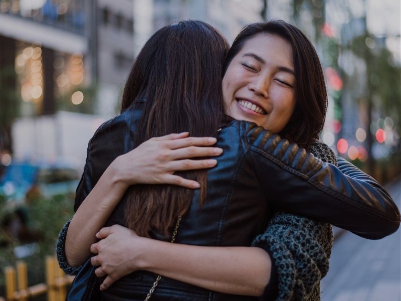 friends in an embrace