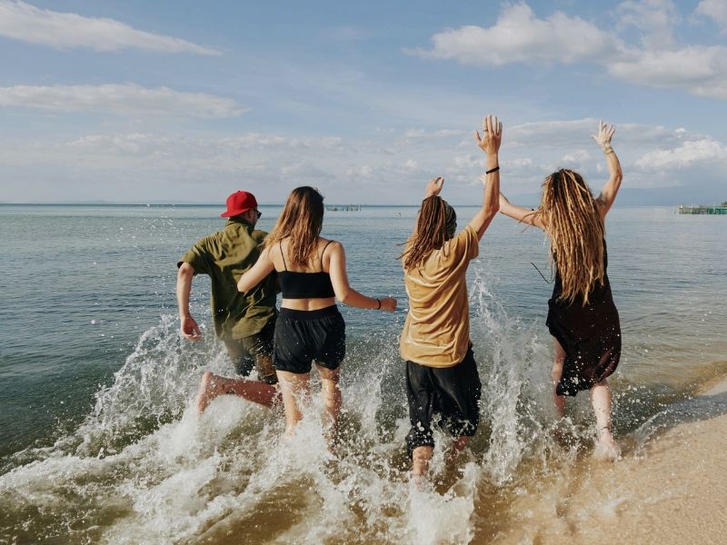 friends running in ocean