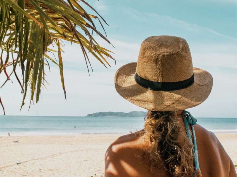 lady with straw hat  beach