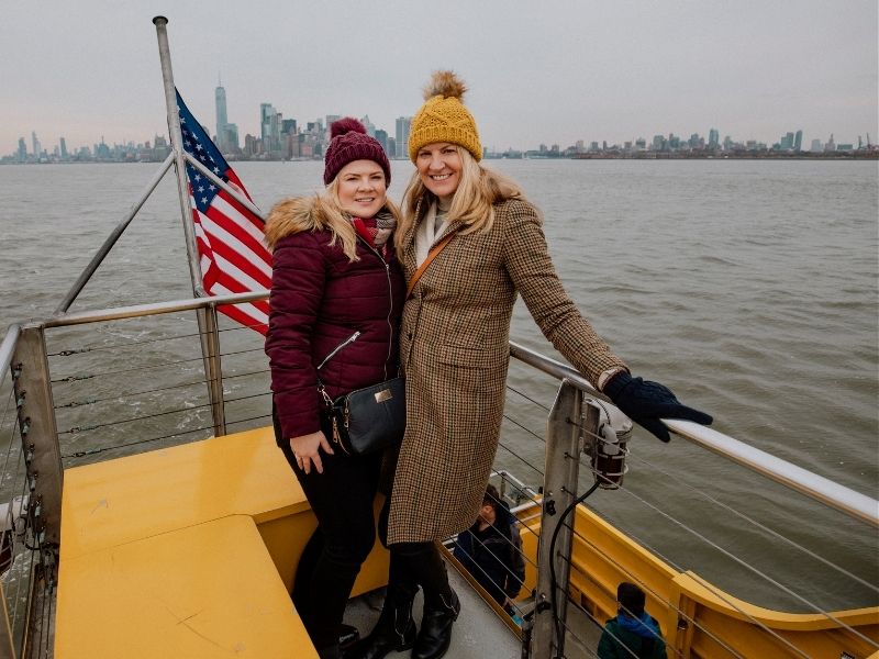 friends on a boat cruise in new york