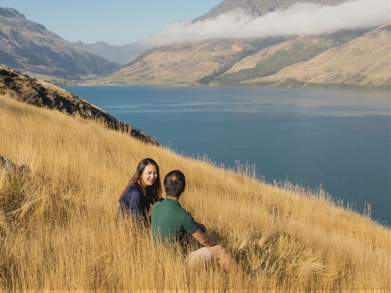 coupling resting after biking on queenstown