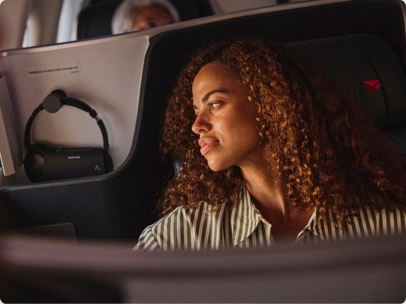 lady relaxing on delta flight
