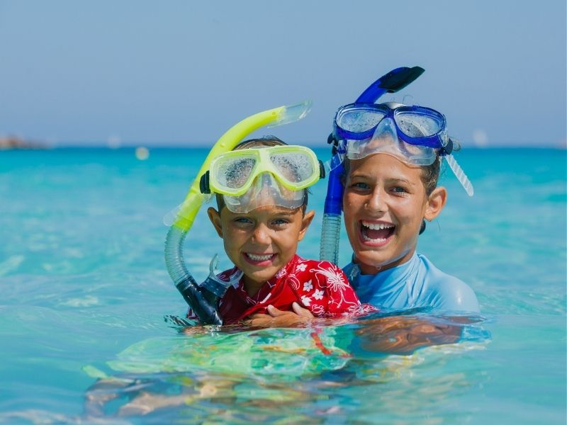 brother snorkelling in ocean
