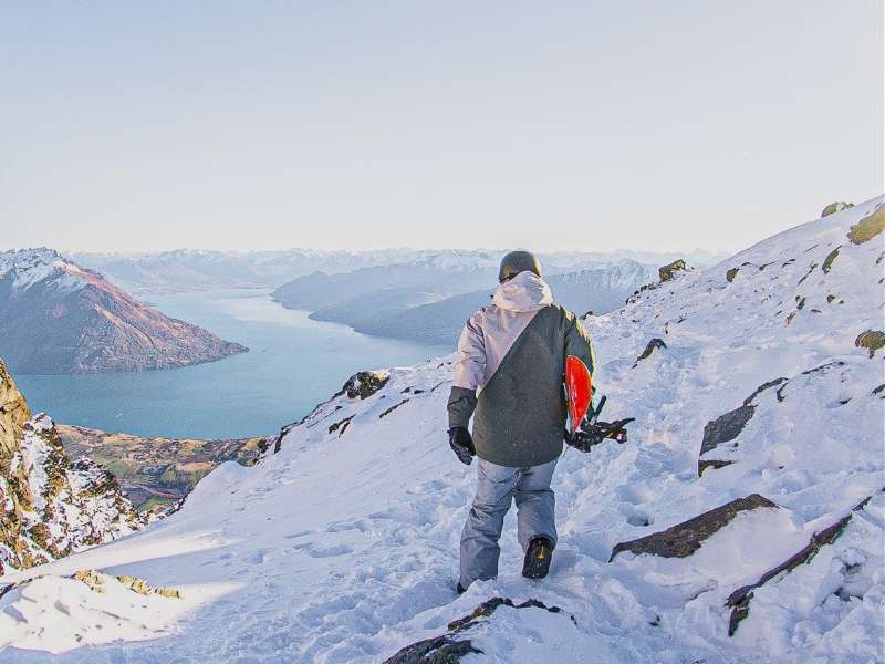 snowboarder on snow covered mountain