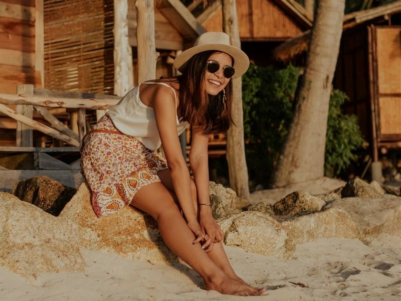 women relaxing and smiling on beach