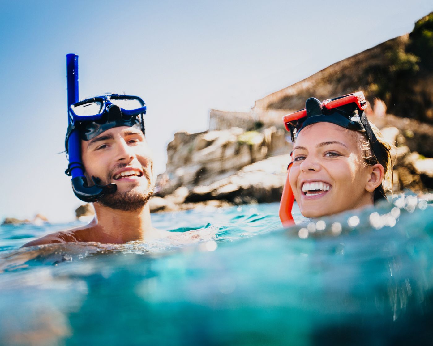 smiling couple snorkelling