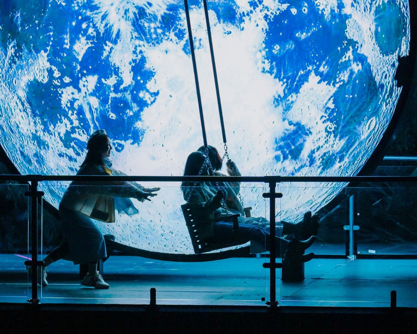 friends on swing in sydney vivid