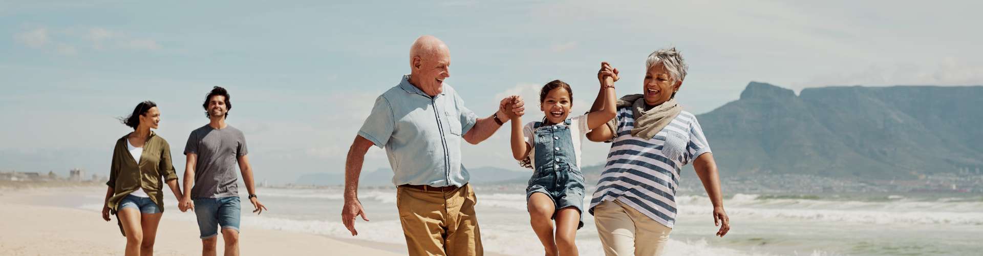 happy family walking on beach