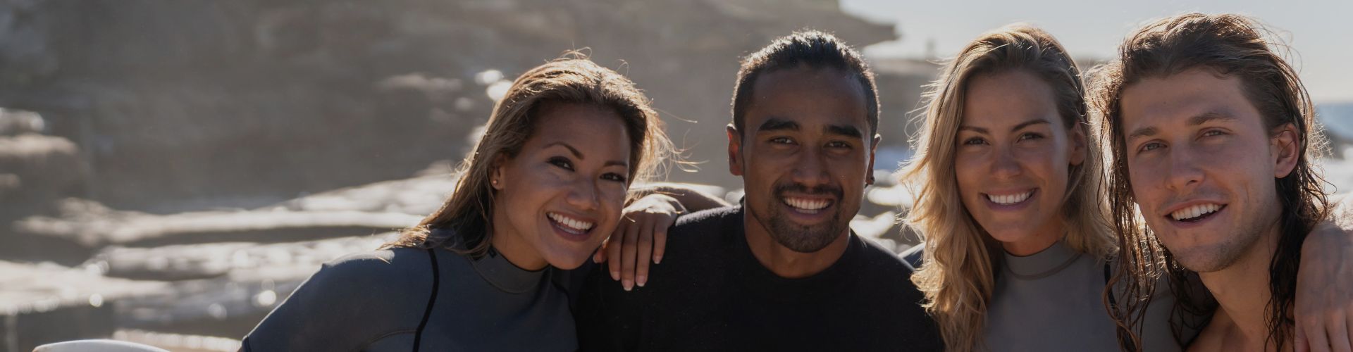 surfer friends at beach