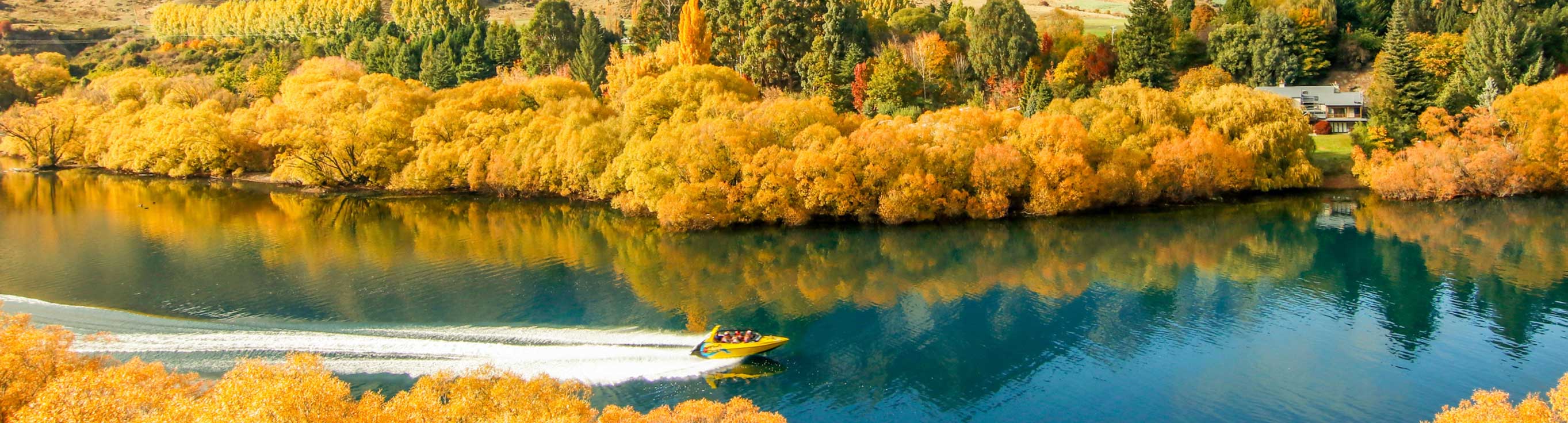 Shotover River with autumn leaves in New Zealand